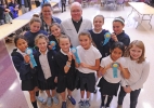 Bishop Richard Malone stands with St Peter and Paul students as they show of their winning ribbons won during the science scrimmage during the Diocese of Buffalo 3rd Annual X-Stream Games and Expo. Area Catholic elementary and middle school students compe